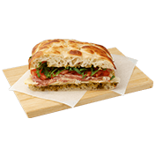 Focaccia Italiana with prosciutto, mozzarella, basil pesto, tomato and rocket.