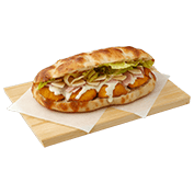 Pinsetta with breaded chicken, Caesar dressing, smoked pork loin, Parmesan flakes and iceberg lettuce.